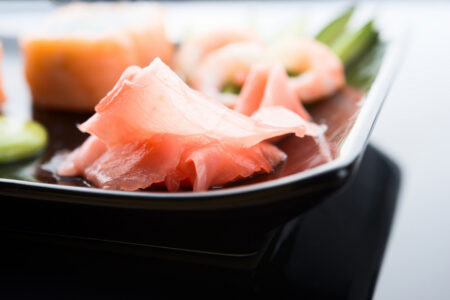 Sushi ginger served beside assorted nigiri as a traditional palate cleanser